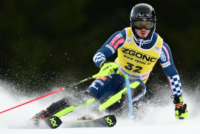 Croatia's Istok Rodes competes in the first run of the Men's Slalom event, part of the FIS Alpine Ski World Cup 2025-2026, in Alta Badia, northern Italy, on December 22, 2025. (Photo by Stefano RELLANDINI / AFP)