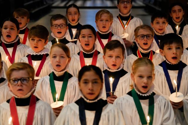 Choristers take part in a rehearsal for their upcoming Christmas performances, at St Paul's Cathedral in central London on December 22, 2025. (Photo by CARLOS JASSO / AFP)