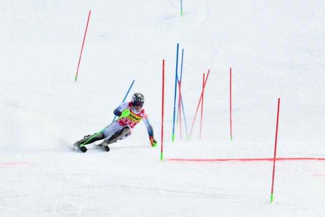 Norway's Timon Haugan crosses the finish line as he competes in the second run of the Men's Slalom event, part of the FIS Alpine Ski World Cup 2025-2026, in Alta Badia, northern Italy, on December 22, 2025. (Photo by Stefano RELLANDINI / AFP)