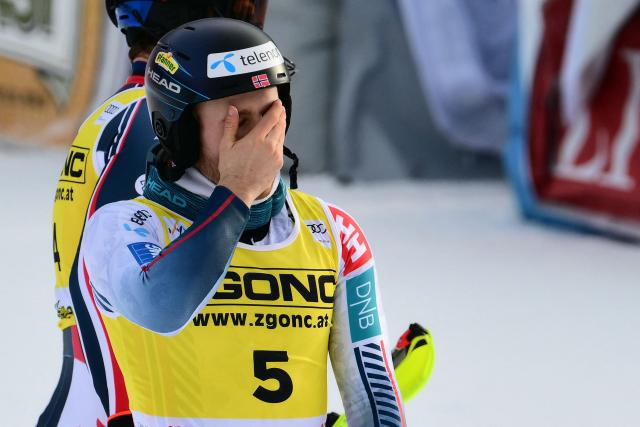 Norway's Atle Lie Mcgrath celebrates at the end of the second run of the Men's Slalom event, part of the FIS Alpine Ski World Cup 2025-2026, in Alta Badia, northern Italy, on December 22, 2025. (Photo by Stefano RELLANDINI / AFP)