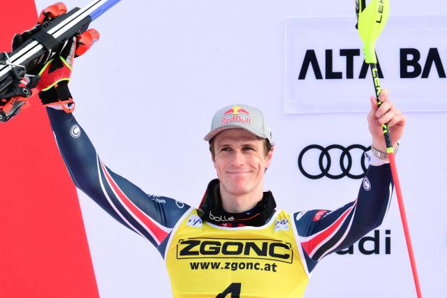 Second placed France's Clement Noel celebrates on the podium of the Men's Slalom event, as part of the FIS Alpine Ski World Cup 2025-2026, in Alta Badia, northern Italy, on December 22, 2025. (Photo by Stefano RELLANDINI / AFP)
