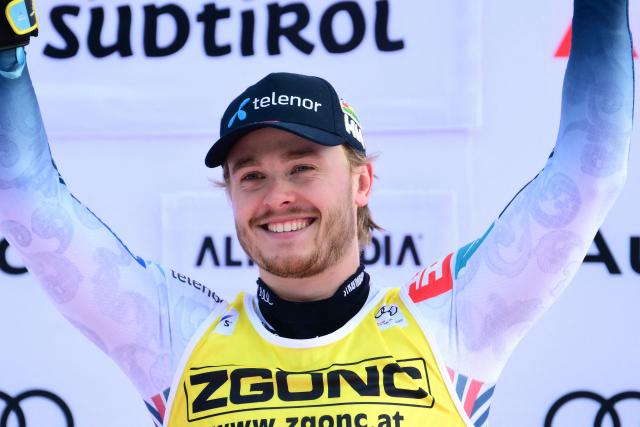 First placed Norway's Atle Lie Mcgrath celebrates on the podium of the Men's Slalom event, as part of the FIS Alpine Ski World Cup 2025-2026, in Alta Badia, northern Italy, on December 22, 2025. (Photo by Stefano RELLANDINI / AFP)