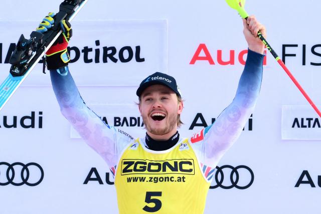 TOPSHOT - First placed Norway's Atle Lie Mcgrath celebrates on the podium of the Men's Slalom event, as part of the FIS Alpine Ski World Cup 2025-2026, in Alta Badia, northern Italy, on December 22, 2025. (Photo by Stefano RELLANDINI / AFP)