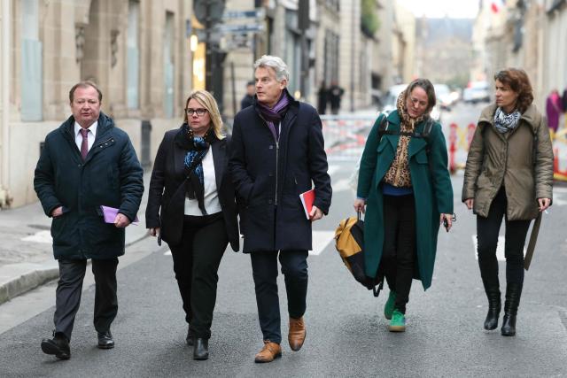National secretary of French far-left Communist party (PCF) Fabien Roussel (C), French PCF senator Cecile Cukierman (2nd-L) and President of Gauche Democrate et Republicaine parliamentary group Stephane Peu (L) arrive for a meeting with France's Prime Minister at the Hotel Matignon in Paris on December 22, 2025, before a cabinet meeting at the end of the day to urgently present a "special bill" aimed at breaking the budget deadlock, following the failure of the parliamentary review of the state budget. A joint committee of French lawmakers on December 19, 2025 failed to reach a compromise on the state budget for next year, parliamentary sources said, meaning France would not have a 2026 budget by year end. The 2025 budget is now likely to be carried over into the new year as debates continue in both chambers. (Photo by Thomas SAMSON / AFP)