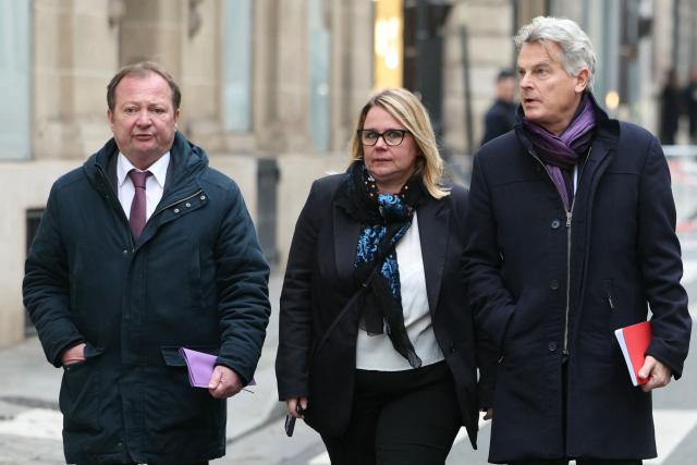 National secretary of French far-left Communist party (PCF) Fabien Roussel (R), French PCF senator Cecile Cukierman (C) and President of Gauche Democrate et Republicaine parliamentary group Stephane Peu (L) arrive for a meeting with France's Prime Minister at the Hotel Matignon in Paris on December 22, 2025, before a cabinet meeting at the end of the day to urgently present a "special bill" aimed at breaking the budget deadlock, following the failure of the parliamentary review of the state budget. A joint committee of French lawmakers on December 19, 2025 failed to reach a compromise on the state budget for next year, parliamentary sources said, meaning France would not have a 2026 budget by year end. The 2025 budget is now likely to be carried over into the new year as debates continue in both chambers. (Photo by Thomas SAMSON / AFP)