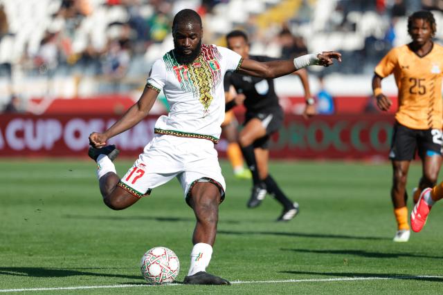 Mali's forward #17 Lassine Sinayoko (L) kicks the ball during the Africa Cup of Nations (AFCON) Group A football match between Mali and Zambia at Mohammed V Stadium in Casablanca, Morocco on December 22, 2025. (Photo by Abdel Majid BZIOUAT / AFP)