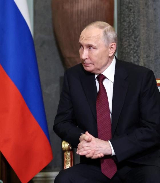 In this pool photograph distributed by the Russian state agency Sputnik, Russia's President Vladimir Putin attends a meeting with Tajik President on the sidelines of an informal summit of the Commonwealth of Independent States (CIS) leaders at the State Hermitage Museum in Saint Petersburg on December 22, 2025. (Photo by Alexander KAZAKOV / POOL / AFP)