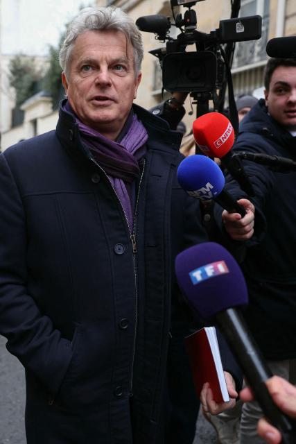 National secretary of French far-left Communist party (PCF) Fabien Roussel arrives for a meeting with France's Prime Minister at the Hotel Matignon in Paris on December 22, 2025, before a cabinet meeting at the end of the day to urgently present a "special bill" aimed at breaking the budget deadlock, following the failure of the parliamentary review of the state budget. A joint committee of French lawmakers on December 19, 2025 failed to reach a compromise on the state budget for next year, parliamentary sources said, meaning France would not have a 2026 budget by year end. The 2025 budget is now likely to be carried over into the new year as debates continue in both chambers. (Photo by Thomas SAMSON / AFP)