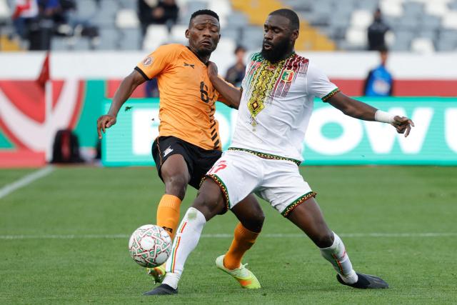 Zambia's midfielder #06 Benson Sakala (L) fights for the ball with Mali's forward #17 Lassine Sinayoko (R) during the Africa Cup of Nations (AFCON) Group A football match between Mali and Zambia at Mohammed V Stadium in Casablanca, Morocco on December 22, 2025. (Photo by Abdel Majid BZIOUAT / AFP)