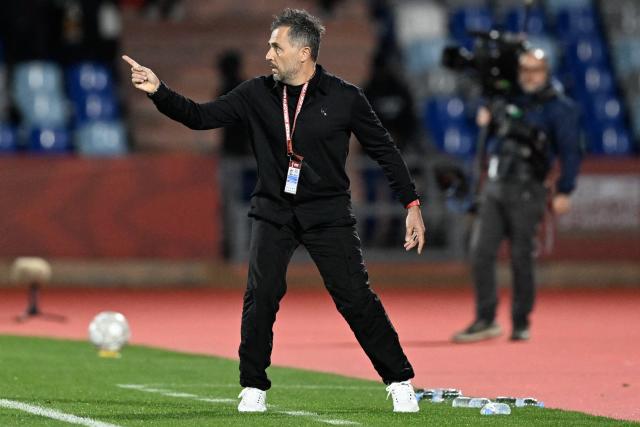 Angola's head coach Patrice Baumelle shouts instructions to his players from the touchline during the Africa Cup of Nations (CAN) Group B football match between South Africa and Angola at Marrakesh Stadium in Marrakesh, Morocco on December 22, 2025. (Photo by Khaled DESOUKI / AFP)