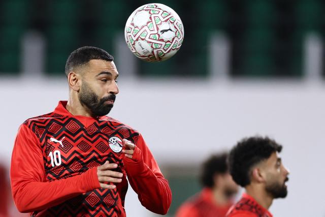 Egypt's forward #10 Mohamed Salah warms up ahead of the Africa Cup of Nations (CAN) group B football match between Egypt and Zimbabwe at Adrar Stadium in Agadir on December 22, 2025. (Photo by FRANCK FIFE / AFP)
