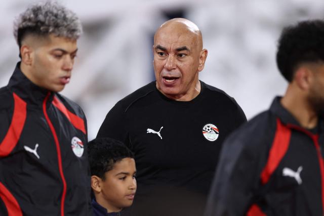 Egypt's head coach Hossam Hassan (C) arrives for the Africa Cup of Nations (CAN) group B football match between Egypt and Zimbabwe at Adrar Stadium in Agadir on December 22, 2025. (Photo by FRANCK FIFE / AFP)