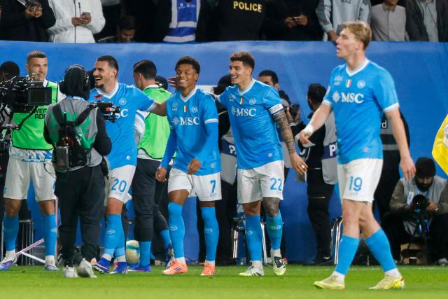 Napoli's Brazilian forward #07 David Neres celebrates with his teammates after scoring his team's second goal during the Italian Super Cup final match between SCC Napoli and Bologna at King Al-Awwal Park Stadium in Riyadh on December 22, 2025. (Photo by Fayez NURELDINE / AFP)