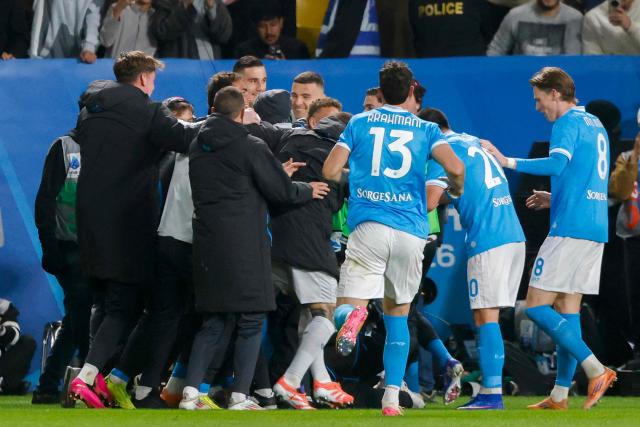 Napoli's players celebrate their team's second goal during the Italian Super Cup final match between SCC Napoli and Bologna at King Al-Awwal Park Stadium in Riyadh on December 22, 2025. (Photo by Fayez NURELDINE / AFP)