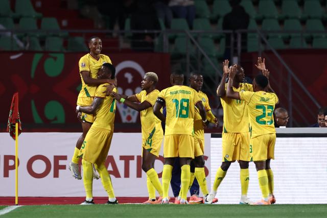 Zimbabwe's forward #07 Prince Dube (L) celebrates scoring the team's first goal during the Africa Cup of Nations (CAN) group B football match between Egypt and Zimbabwe at Adrar Stadium in Agadir on December 22, 2025. (Photo by FRANCK FIFE / AFP)