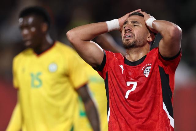 Egyptian midfielder #07 Trezeguet reacts after failing to score during the Africa Cup of Nations (CAN) group B football match between Egypt and Zimbabwe at Adrar Stadium in Agadir on December 22, 2025. (Photo by FRANCK FIFE / AFP)