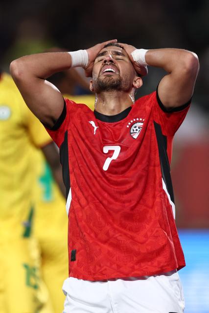 Egyptian midfielder #07 Trezeguet reacts after failing to score during the Africa Cup of Nations (CAN) group B football match between Egypt and Zimbabwe at Adrar Stadium in Agadir on December 22, 2025. (Photo by FRANCK FIFE / AFP)