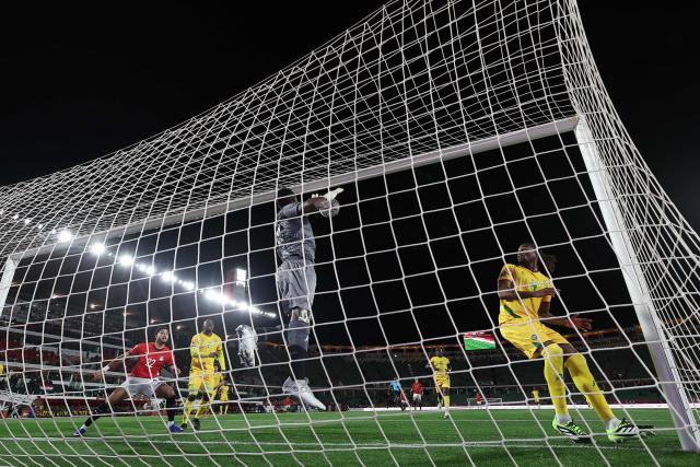Zimbabwe's goalkeeper #22 Washington Arubi makes a save during the Africa Cup of Nations (CAN) group B football match between Egypt and Zimbabwe at Adrar Stadium in Agadir on December 22, 2025. (Photo by FRANCK FIFE / AFP)