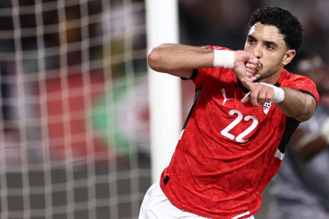 Egypt's forward #22 Omar Marmoush celebrates scoring the team's first goal during the Africa Cup of Nations (CAN) group B football match between Egypt and Zimbabwe at Adrar Stadium in Agadir on December 22, 2025. (Photo by FRANCK FIFE / AFP)