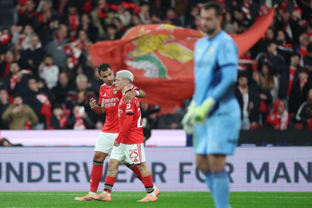 SL Benfica's Greek forward #14 Vangelis Pavlidis (L) celebrates scoring the opening goal during the Portuguese League football match between SL Benfica and FC Famalicao at Estadio da Luz in Lisbon on December 22, 2025. (Photo by PATRICIA DE MELO MOREIRA / AFP)