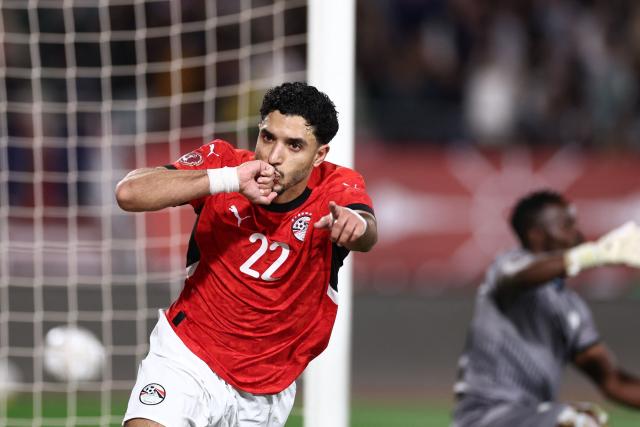 Egypt's forward #22 Omar Marmoush celebrates scoring the team's first goal during the Africa Cup of Nations (CAN) group B football match between Egypt and Zimbabwe at Adrar Stadium in Agadir on December 22, 2025. (Photo by FRANCK FIFE / AFP)