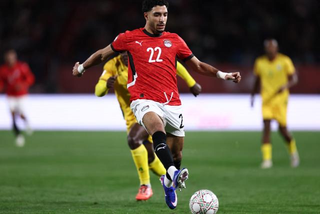 Egypt's forward #22 Omar Marmoush scores the team's first goal during the Africa Cup of Nations (CAN) group B football match between Egypt and Zimbabwe at Adrar Stadium in Agadir on December 22, 2025. (Photo by FRANCK FIFE / AFP)