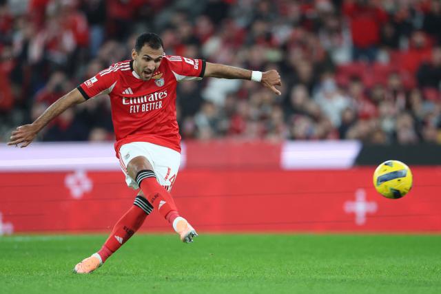 SL Benfica's Greek forward #14 Vangelis Pavlidis scores the opening goal from the penalty spot during the Portuguese League football match between SL Benfica and FC Famalicao at Estadio da Luz in Lisbon on December 22, 2025. (Photo by PATRICIA DE MELO MOREIRA / AFP)