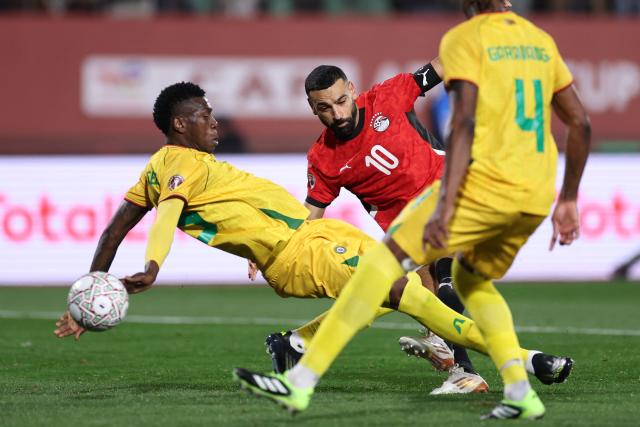 Egypt's forward #10 Mohamed Salah scores the team's second goal during the Africa Cup of Nations (CAN) group B football match between Egypt and Zimbabwe at Adrar Stadium in Agadir on December 22, 2025. (Photo by FRANCK FIFE / AFP)