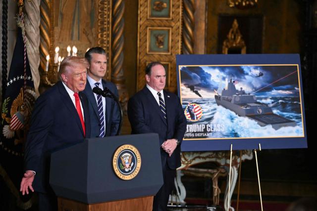 US President Donald Trump (L) flanked by US Secretary of Defense Secretary Pete Hegseth (C) and Navy Secretary John Phelan (R), announces the US Navy’s new Golden Fleet initiative, unveiling a new class of frigates, at Mar-a-Lago in Palm Beach, Florida, on December 22, 2025. (Photo by ANDREW CABALLERO-REYNOLDS / AFP)