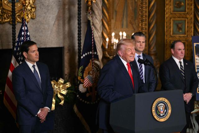 US President Donald Trump (2L) flanked by US Secretary of State Marco Rubio (L), US Secretary of Defense Pete Hegseth (2R) and US Navy Secretary John Phelan (R), announces the US Navy’s new Golden Fleet initiative, unveiling a new class of frigates, at Mar-a-Lago in Palm Beach, Florida, on December 22, 2025. (Photo by ANDREW CABALLERO-REYNOLDS / AFP)
