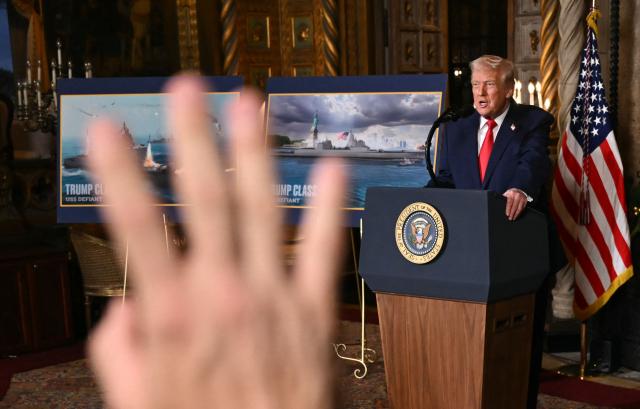 US President Donald Trump takes questions from journalists after announcing the US Navy’s new Golden Fleet initiative, unveiling a new class of warships, at Mar-a-Lago in Palm Beach, Florida, on December 22, 2025. (Photo by ANDREW CABALLERO-REYNOLDS / AFP)