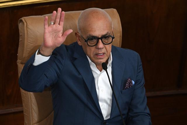 Venezuela's National Assembly President Jorge Rodriguez votes during a extraordinary session at the National Assembly in Caracas on December 22, 2025. (Photo by Federico PARRA / AFP)