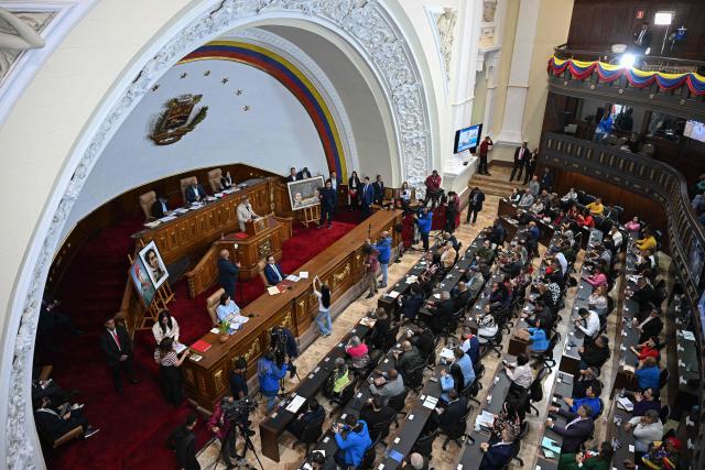 General view of the National Assembly during an extraordinary session at the Federal Legislative Palace in Caracas on December 22, 2025. (Photo by Federico PARRA / AFP)