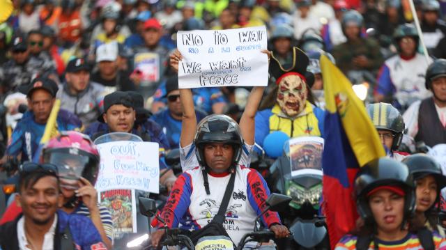 Motorcyclists supporting Venezuelan President Nicolas Maduro take part in a motorcade to protest against the United States in Caracas on December 22, 2025. Dressed as pirates, dozens of motorcyclists rode through Caracas on December 22 to protest the seizure of ships carrying Venezuelan oil by the United States as part of its blockade against sanctioned tankers. (Photo by Pedro MATTEY / AFP)