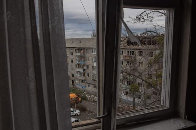 This photograph shows a view of a heavily damaged residential building following a drone strike in Kyiv on December 23, 2025, amid the Russian invasion of Ukraine. Several Ukrainian regions suffered power cuts in frigid winter weather on December 23, 2025, after Russia launched its latest deadly large-scale attack with drones and missiles, authorities said. (Photo by Roman PILIPEY / AFP)