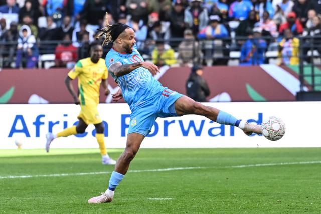 Democratic Republic Of Congo's forward #10 Theo Bongonda scores a goal during the Africa Cup of Nations (CAN) Group D football match between Democratic Republic of Congo and Benin at Al Medina Stadium in Rabat on December 23, 2025. (Photo by SEBASTIEN BOZON / AFP)