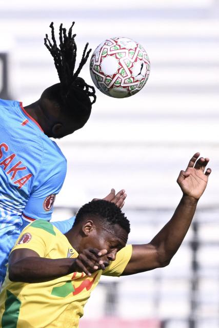 Democratic Republic Of Congo's defender #02 Aaron Wan-Bissaka (Top) and Benin's forward #20 Jodel Dossou vie in the air during the Africa Cup of Nations (CAN) Group D football match between Democratic Republic of Congo and Benin at Al Medina Stadium in Rabat on December 23, 2025. (Photo by SEBASTIEN BOZON / AFP)