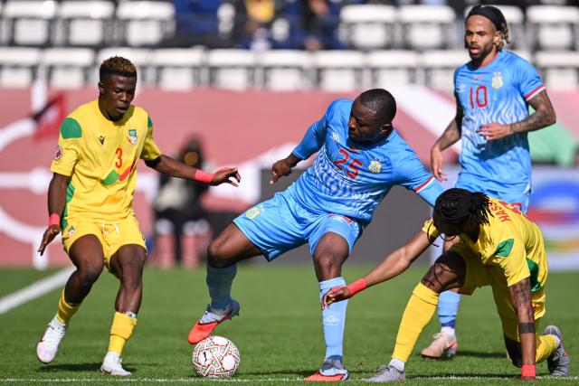 Benin's defender #03 Tamimou Ouorou vies with Democratic Republic Of Congo's midfielder #25 Edo Kayembe aduring the Africa Cup of Nations (CAN) Group D football match between Democratic Republic of Congo and Benin at Al Medina Stadium in Rabat on December 23, 2025. (Photo by SEBASTIEN BOZON / AFP)