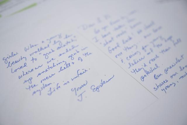 This photo illustration taken in Washington, DC, on December 23, 2025 shows a new batch of files released on Tuesday by the US government in relation to the notorious late sex offender Jeffrey Epstein. The latest release contains previously unseen material from the investigation into Epstein, a wealthy US financier who died in jail in 2019 while awaiting trial for sex trafficking underage girls. (Photo by AFP)