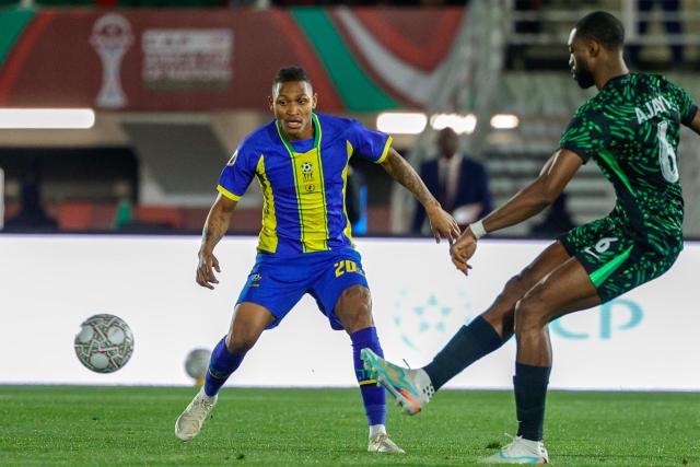 Tanzania's midfielder #20 Novatus Miroshi vies with Nigeria's defender #06 Semi Ajayi during the Africa Cup of Nations (CAN) Group C football match between Nigeria and Tanzania at Fez Stadium in Fes on December 23, 2025. (Photo by Abdel Majid BZIOUAT / AFP)