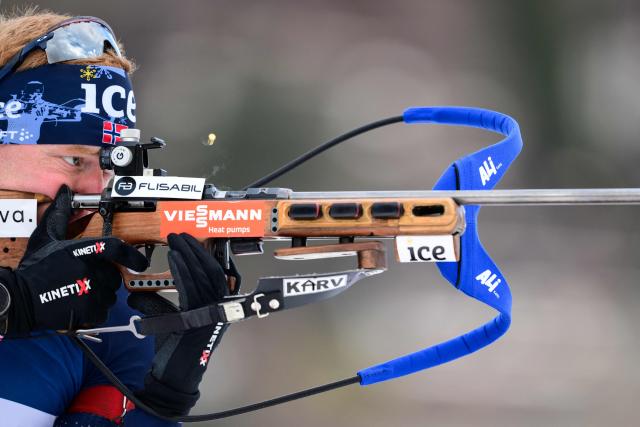 (FILES) Norway's Sivert Guttorm Bakken fires his rifle during a training ahead of the men's 10km sprint event of the IBU Biathlon World Cup, in Le Grand Bornand, near Annecy, southeastern France, on December 19, 2025. Norwegian biathlete Sivert Guttorm Bakken, 27, has been found dead in his hotel room in Lavaze, Italy, the Norwegian Biathlon Association said Tuesday, adding that the cause of death was unknown. (Photo by Olivier CHASSIGNOLE / AFP)