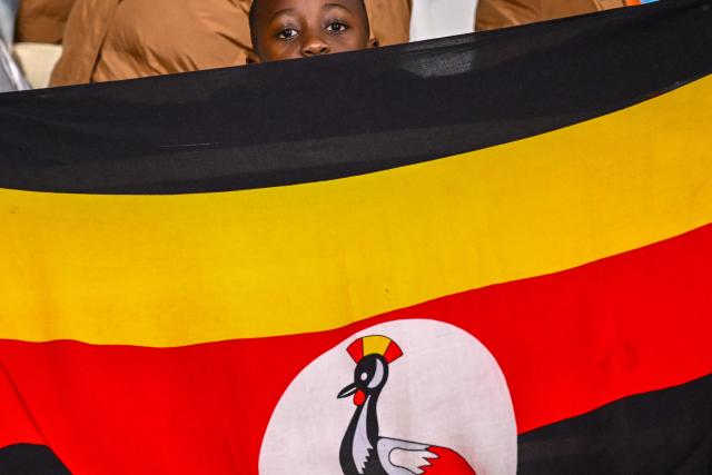An Uganda supporter cheers ahead of the Africa Cup of Nations (CAN) Group C football match between Tunisia and Uganda at Rabat Olympic Stadium in Rabat on December 23, 2025. (Photo by SEBASTIEN BOZON / AFP)