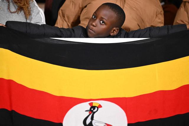 An Uganda supporter cheers ahead of the Africa Cup of Nations (CAN) Group C football match between Tunisia and Uganda at Rabat Olympic Stadium in Rabat on December 23, 2025. (Photo by SEBASTIEN BOZON / AFP)