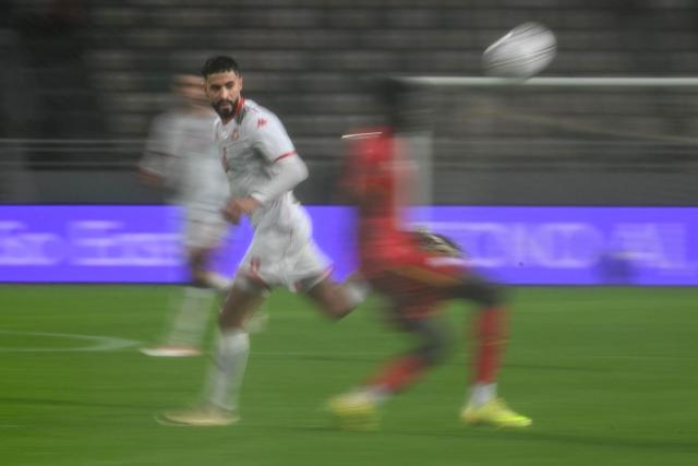 Tunisia's forward #08 Elias Saad eyes the ball during the Africa Cup of Nations (CAN) Group C football match between Tunisia and Uganda at Rabat Olympic Stadium in Rabat on December 23, 2025. (Photo by Paul ELLIS / AFP)