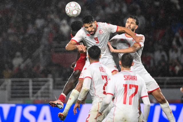 Tunisia's forward #09 Hazem Mastouri heads the ball during the Africa Cup of Nations (CAN) Group C football match between Tunisia and Uganda at Rabat Olympic Stadium in Rabat on December 23, 2025. (Photo by SEBASTIEN BOZON / AFP)