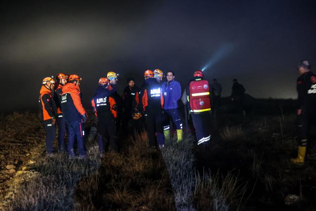 Rescuers work as search and rescue operations are ungoing at the wreckage site following the crash of a Libya-bound business jet carrying Libyan Chief of Staff General Muhammad Ali Ahmed Al-Haddad, found 2 kilometers south of Kesikkavak Village at Haymana district in Ankara on December 23, 2025. The head of Libya's armed forces and four other passengers died on December 23, 2025, when their business jet crashed shortly after taking off from Ankara, officials in Turkey's capital and Tripoli said. The wreckage of their Falcon 50 aircraft was located by Turkish security personnel in the Haymana district near Ankara, Turkey's Interior Minister said. (Photo by ADEM ALTAN / AFP)