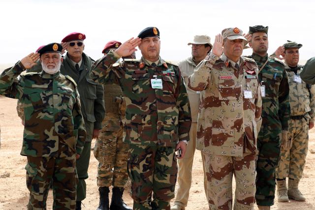 (FILES) Lieutenant General Mohammad Ali al-Haddad (C), chief of the general staff of the Libyan army, attends a defence exercise for members of Libya's Petroleum Facilites Guard near the town of Bir al-Ghanam, about 100 kilometres southwest of Libya's capital Tripoli, on March 22, 2021. The head of Libya's armed forces General Muhammad Ali al-Haddad and four other passengers died on December 23, 2025, when their business jet crashed shortly after taking off from Ankara, officials in Turkey's capital and Tripoli said. The wreckage of their Falcon 50 aircraft was located by Turkish security personnel in the Haymana district near Ankara, Turkey's Interior Minister said. (Photo by Mahmud Turkia / AFP)