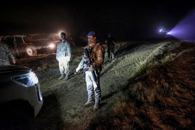 Turkish soldiers stand guard at the wreckage site of a Libya-bound business jet as search and rescue operations continue following the crash of a Falcon 50 aircraft carrying Libyan Chief of Staff General Muhammad Ali Ahmed Al-Haddad, found 2 kilometers south of Kesikkavak Village at Haymana district in Ankara on December 23, 2025 . The head of Libya's armed forces and four other passengers died on December 23, 2025, when their business jet crashed shortly after taking off from Ankara, officials in Turkey's capital and Tripoli said. The wreckage of their Falcon 50 aircraft was located by Turkish security personnel in the Haymana district near Ankara, Turkey's Interior Minister said. (Photo by ADEM ALTAN / AFP)