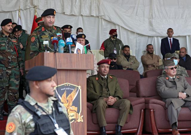 (FILES) Lieutenant General Mohammad Ali al-Haddad, chief of the general staff of the Libyan army, speaks during a military graduation ceremony in the capital Tripoli on January 23, 2022. The head of Libya's armed forces General Muhammad Ali al-Haddad and four other passengers died on December 23, 2025, when their business jet crashed shortly after taking off from Ankara, officials in Turkey's capital and Tripoli said. The wreckage of their Falcon 50 aircraft was located by Turkish security personnel in the Haymana district near Ankara, Turkey's Interior Minister said. (Photo by Mahmud Turkia / AFP)