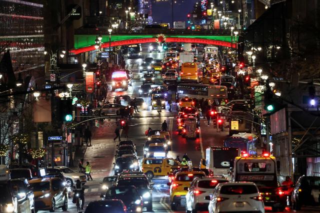 Heavy traffic is seen on December 23, 2025 in New York. (Photo by ANGELA WEISS / AFP)